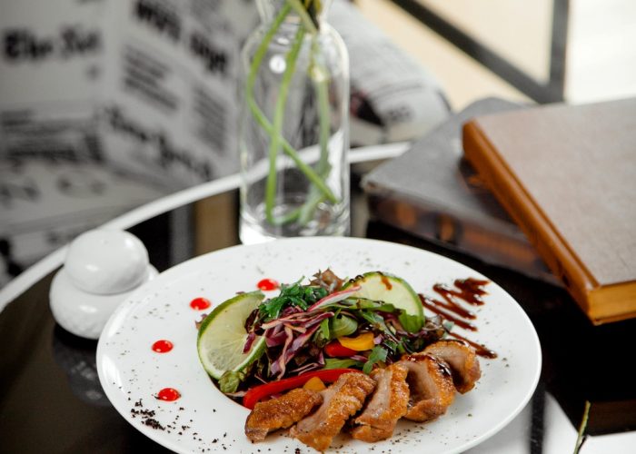 crispy fried meat slices served with vegetable salad